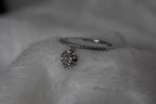 Ring with heart-shaped pendant