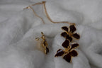 Set of earrings and red flower pendants
