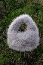 Women's handbag with faux fox fur design