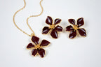 Set of earrings and red flower pendants