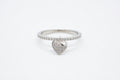 Ring with heart-shaped pendant